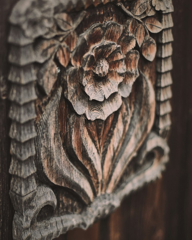Detailed carved wooden panel with geometric grain relief pattern