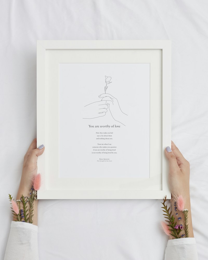 Hand-drawn flower sketch print in a white frame on white textile