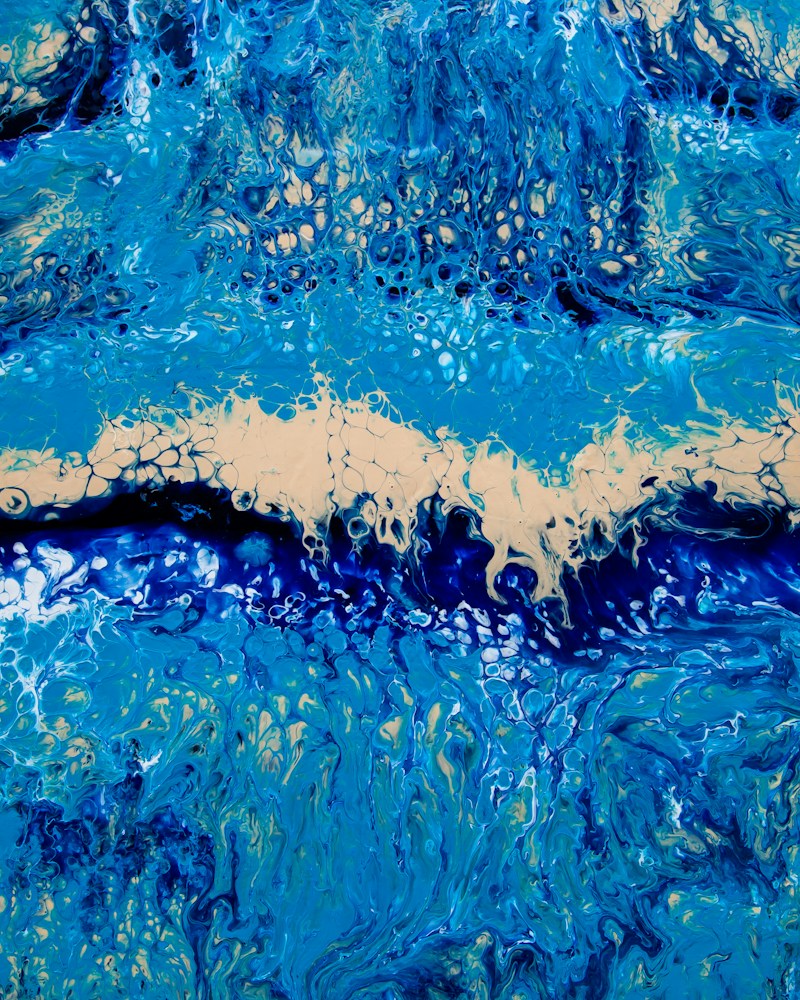 Close-up of water droplets on a deep blue resin surface